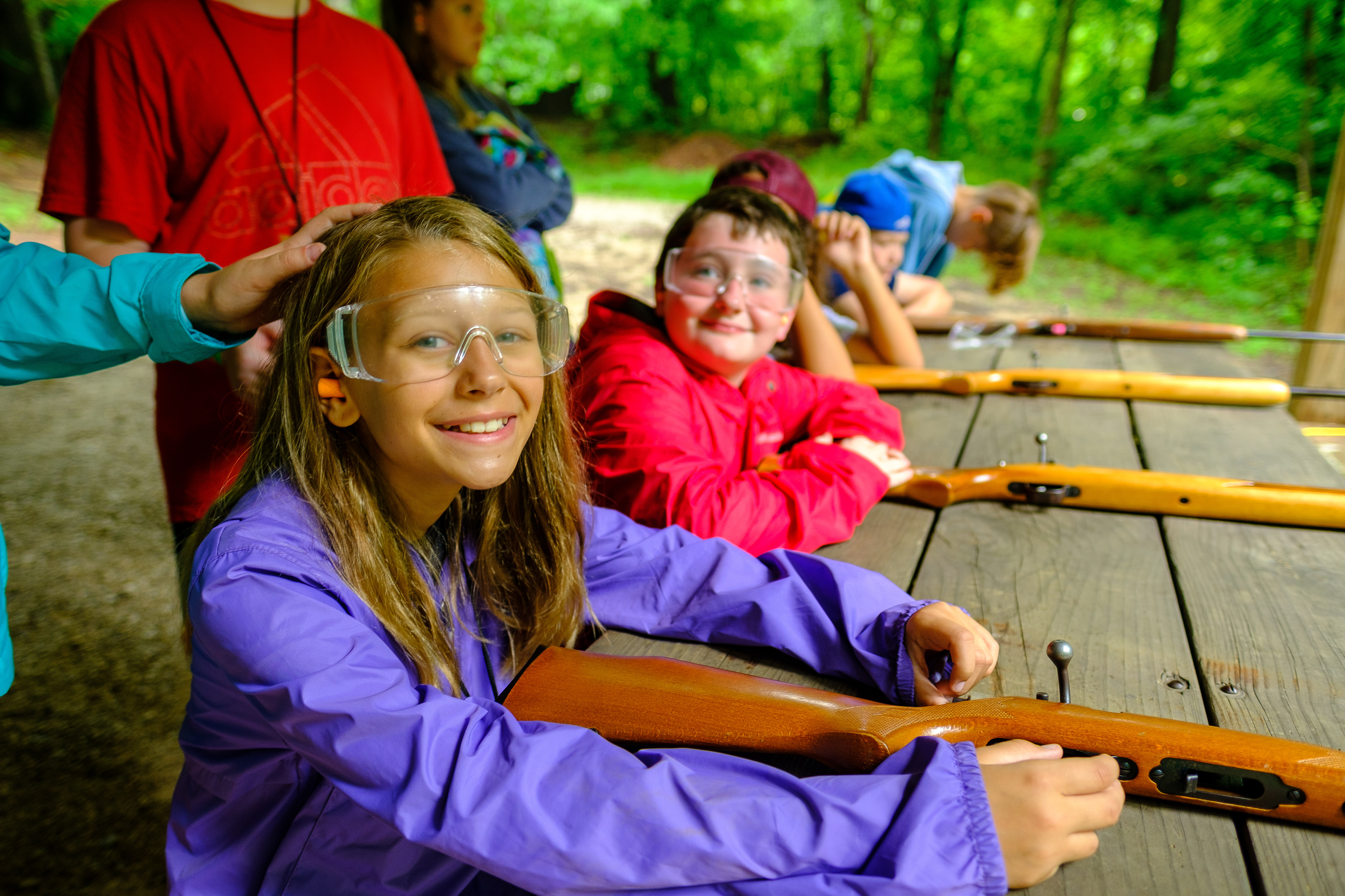 female attending shooting sports camp