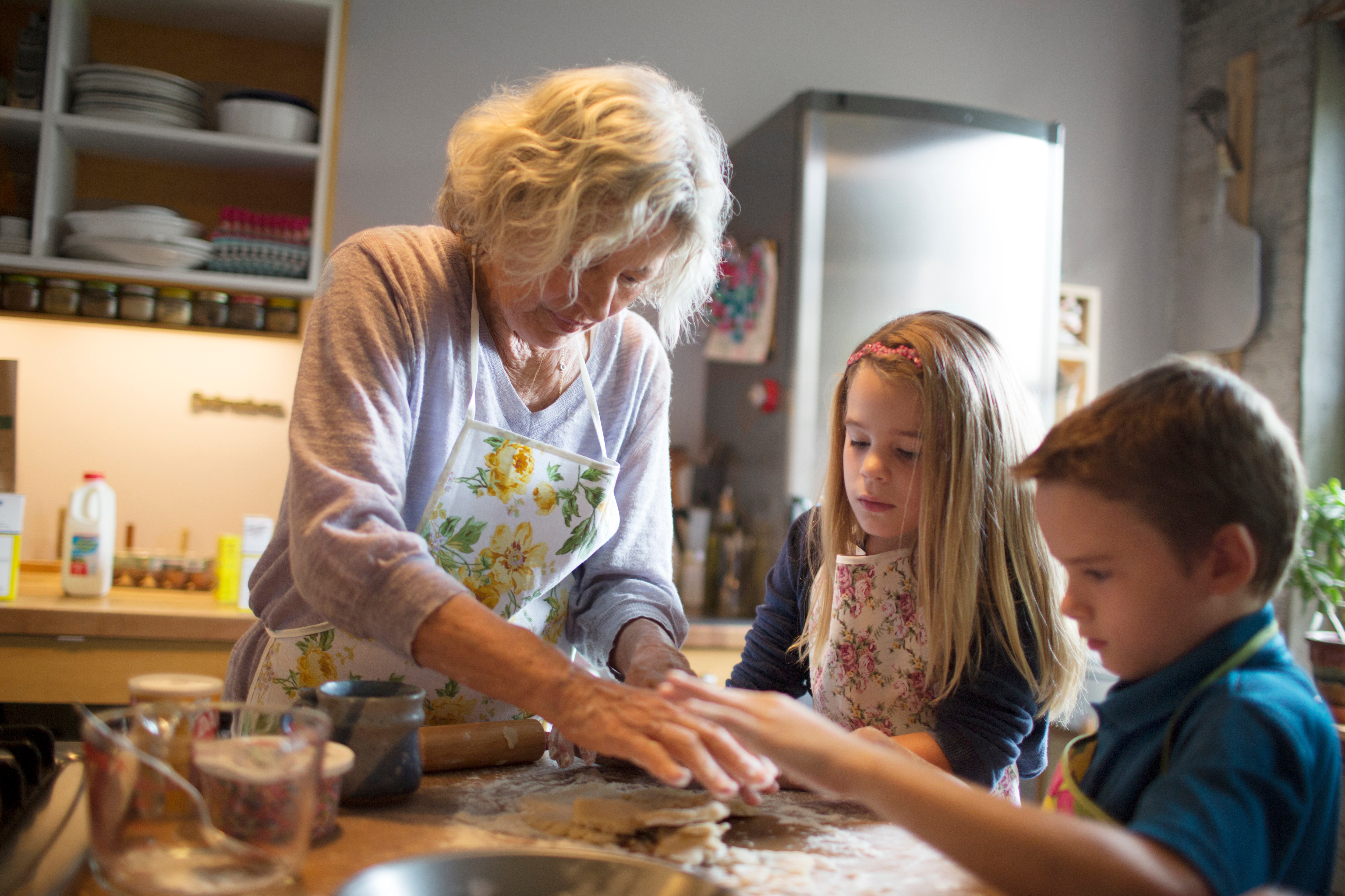 Grandmother teaching grandkids to cook